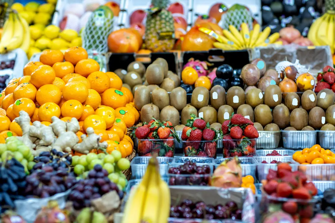 Wide selection of fresh fruit at a market counter